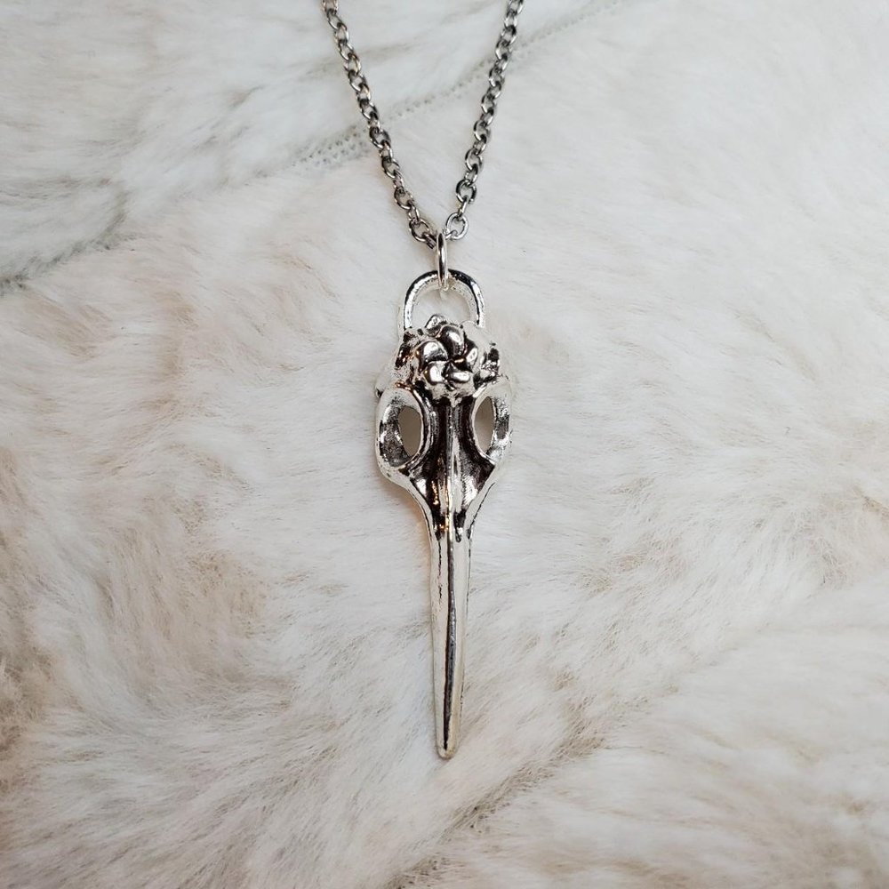 Bird skull plague doctor charm necklace.
